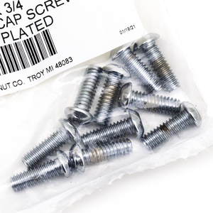 Vista cenital de un surtido de tornillos Torx con cabeza botón de acabado cromado brillante